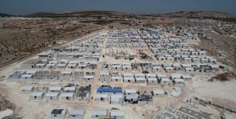 İdlib'de yapılan 'Cihannüma Evleri' ailelere teslim edildi