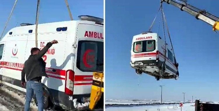 Kara saplanan ambulans vinçle kurtarıldı